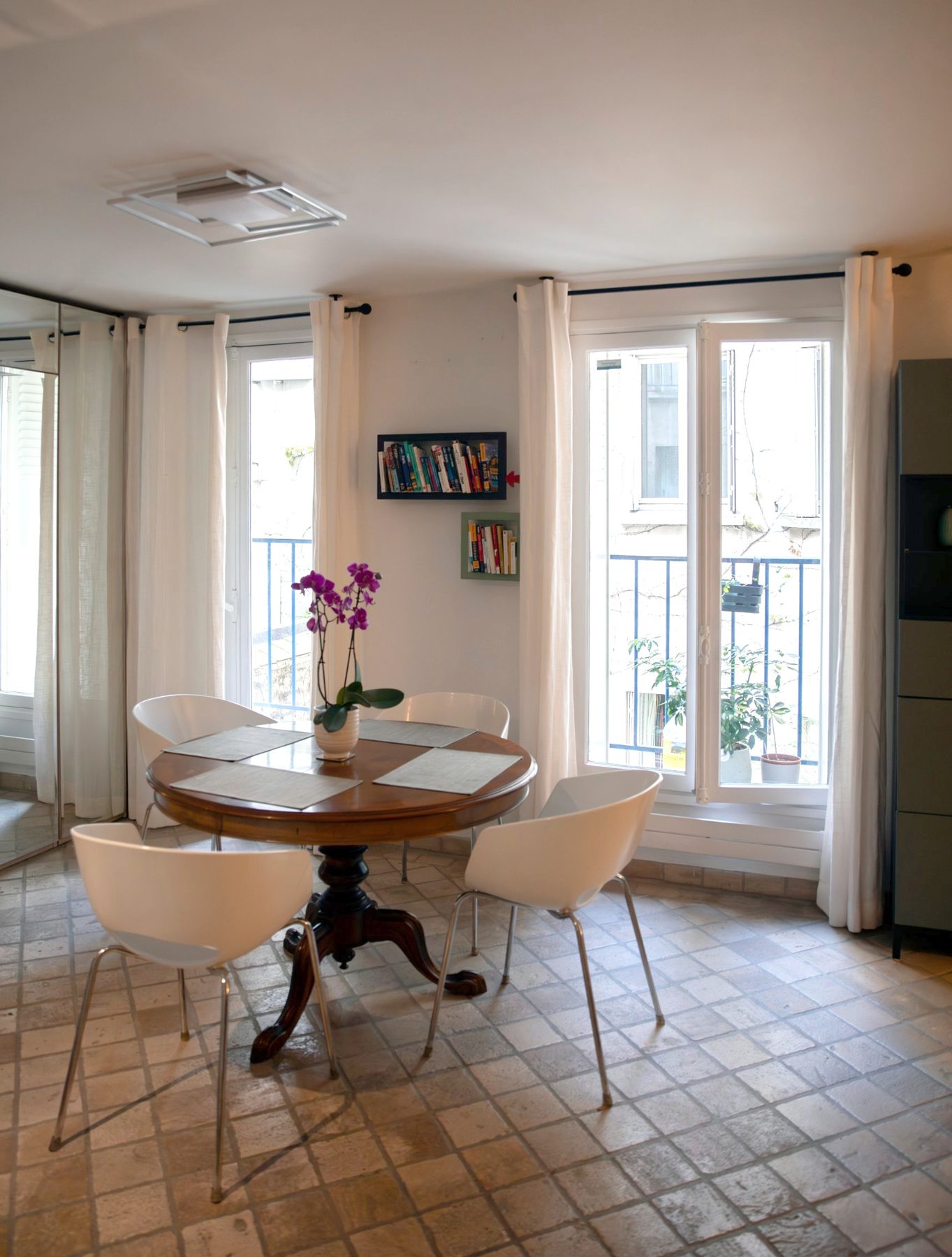 Dining table by the tall windows
